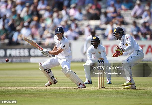 England Captain Alastair Cook batting as Sri Lanka wicket-keeper Dinesh Chandimal looks on during day one of the 3rd Investec Test match between...