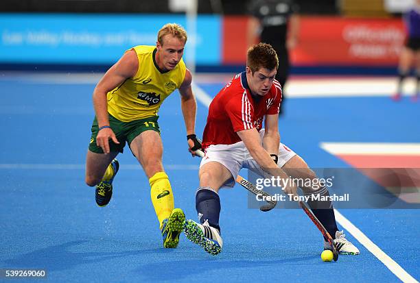 Henry Weir of Great Britain is tackled by Aran Zalewski of Australia during the FIH Men's Hero Hockey Champions Trophy 2016 - Day One match between...