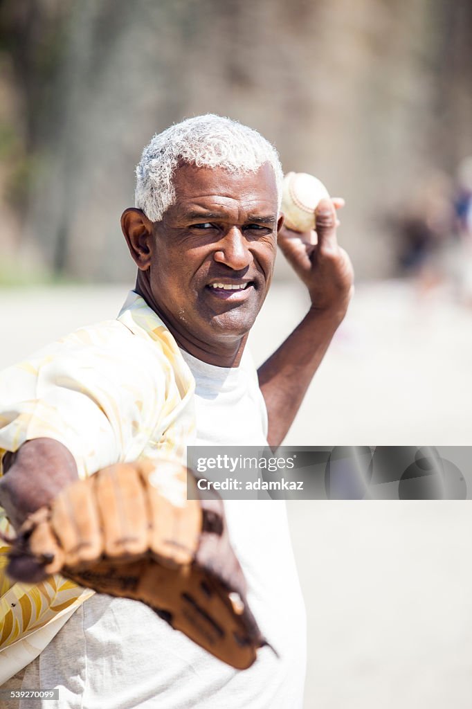 African American Senior Man Playing Baseball Catch