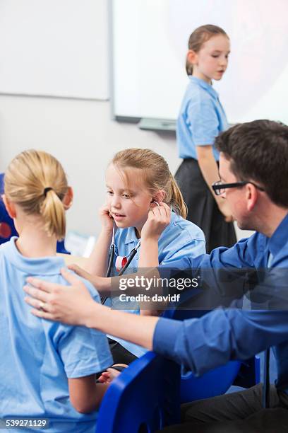 Student Listen Children Listening In Class Photos and Premium High Res Pictures ...