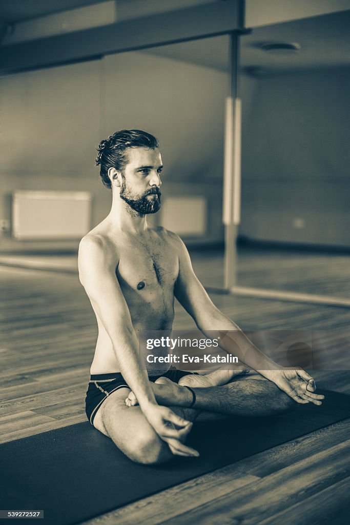 Young man exercising yoga