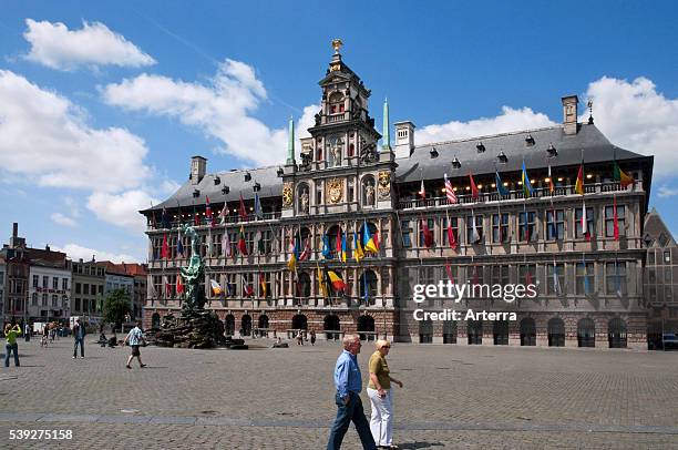 City hall and fountain statue of Silvius Brabo throwing the giant's hand at the Grote markt / Town Square, Antwerp, Belgium.