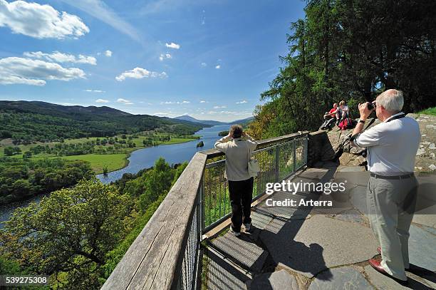 Tourists looking over Loch Tummel from Queen´_s View near Pitlochry in Perth and Kinross, Scotland, UK.