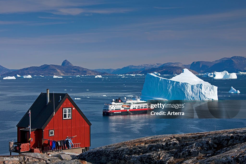 Cruise ship among icebergs in the Uummannaq fjord