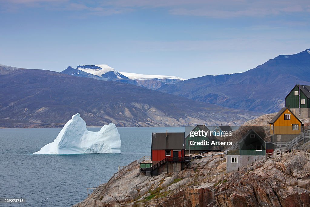 Uummannaq village with colourful houses and icebergs in the fjord