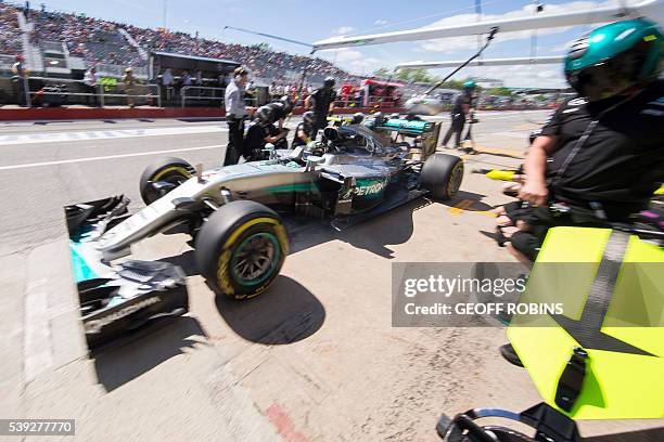 German racing driver Sebastian Vettel of team Scuderua Ferrari accelerates after a pit stop at the Gilles-Villeneuve track during an afternoon...