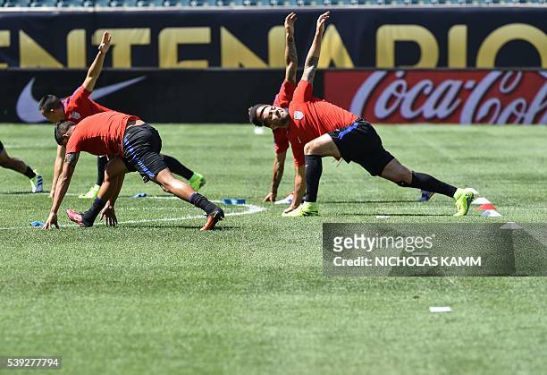 Members of the US national team warm up during a training session in Philadelphia on June 10 on the eve of US's Copa America Group C first round...