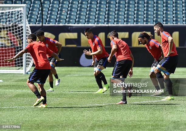 Members of the US national team warm up during a training session in Philadelphia on June 10 on the eve of US's Copa America Group C first round...