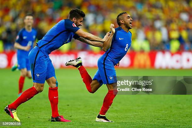 Dimitri Payet of France celebrates scoring his team's second goal during the UEFA Euro 2016 Group A match between France and Romania at Stade de...
