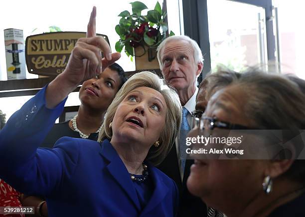 Anticlockwise from center, Democratic presidential candidate Hillary Clinton, DC Councilmember Anita Bonds, DC Councilmember Jack Evans and DC Mayor...