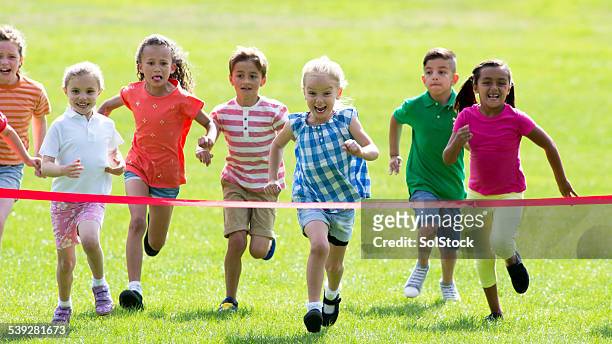 race to the finish - running boy stock pictures, royalty-free photos & images