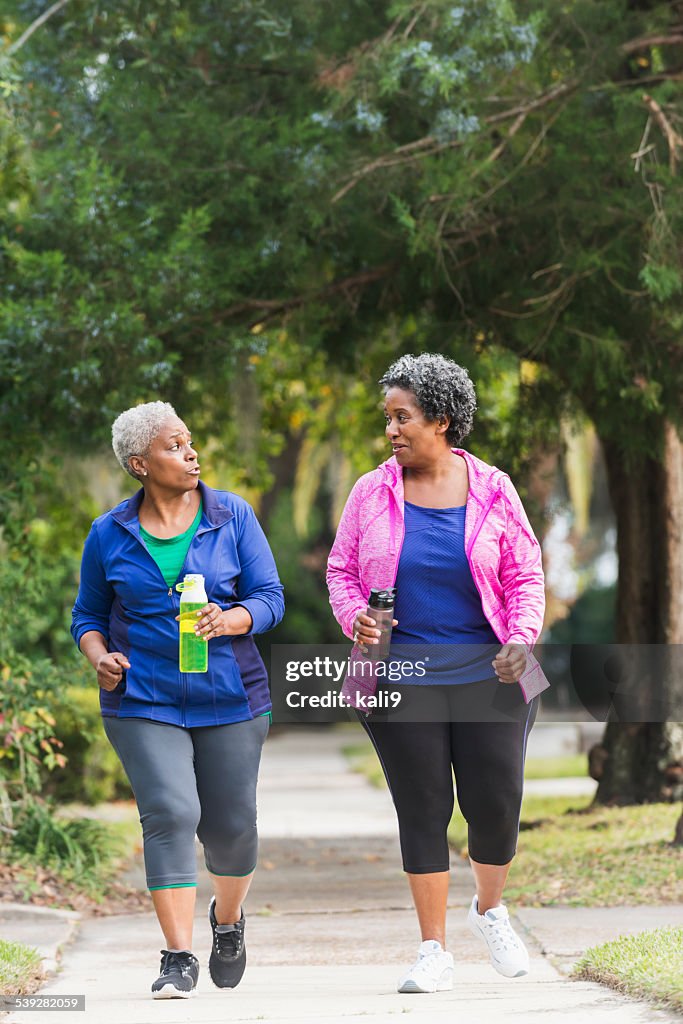 Two senior black women exercising together