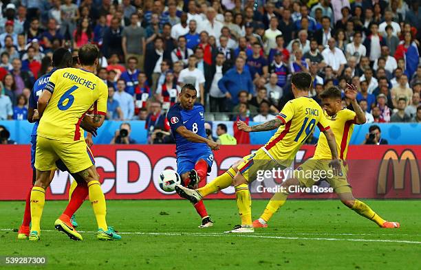 Dimitri Payet of France scores his team's second goal during the UEFA Euro 2016 Group A match between France and Romania at Stade de France on June...