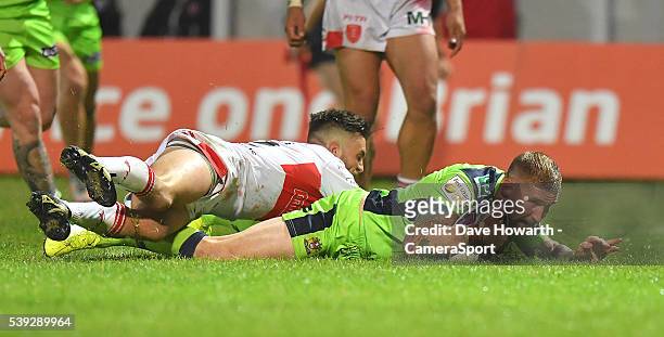 Sam Tomkins of Wigan Warriors scores his sides winning try during the First Utility Super League Round 18 match between Hull Kingston Rovers and...