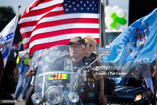 Native American Vietnam Veteran and his wife ride in the Red Earth Native American Festival parade, Friday, June 10, 2016 in Oklahoma City.