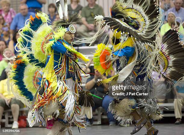 Two fancy dancers dance against each other like warriors from different tribes would have danced at the Red Earth Native American Festival, Friday,...