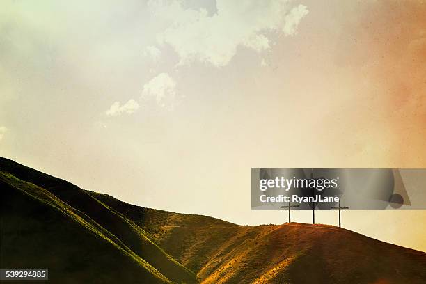 crosses on hillside - religious cross stock pictures, royalty-free photos & images