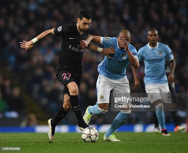 Javier Pastore of Paris Saint-Germain and Fernando of Manchester City in action during the UEFA Champions League Quarter Final Second Leg match...