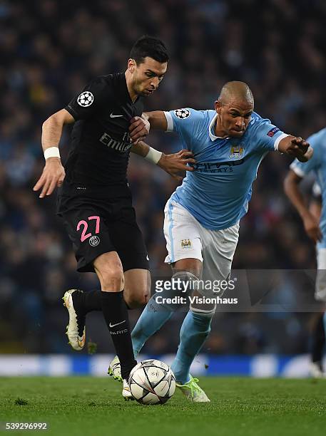 Javier Pastore of Paris Saint-Germain and Fernando of Manchester City in action during the UEFA Champions League Quarter Final Second Leg match...