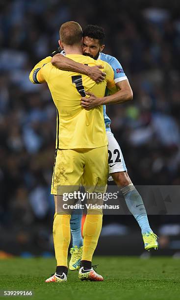 Gael Clichy and Joe Hart of Manchester City celebrate after the UEFA Champions League Quarter Final Second Leg match between Manchester City FC and...