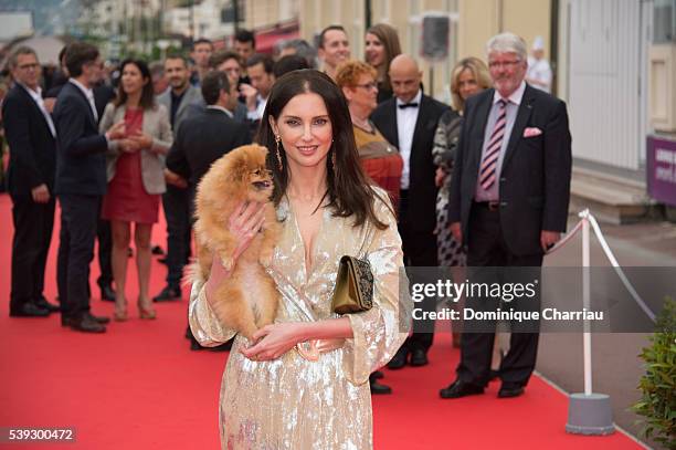 Frederique Bel and her dog "chouquette" attend the 30th Cabourg Film Festival : Day Three on June 10, 2016 in Cabourg, France.