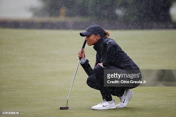 Cheyenne Woods lines up a putt on the 9th green as it starts to rain during the second round of the KPMG Women's PGA Championship at Sahalee Country...