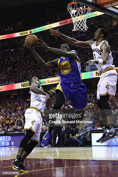 Draymond Green of the Golden State Warriors shoots the ball against Channing Frye of the Cleveland Cavaliers during the first half in Game 4 of the...