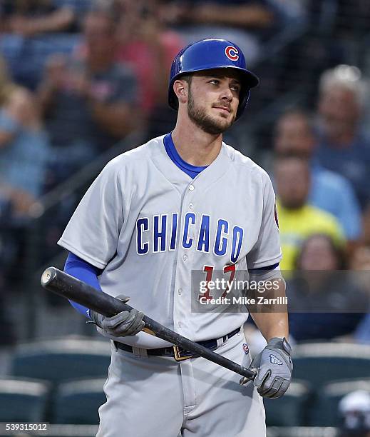 Third baseman Kris Bryant of the Chicago Cubs reacts to striking out in the fourth inning during the game against the Atlanta Braves at Turner Field...