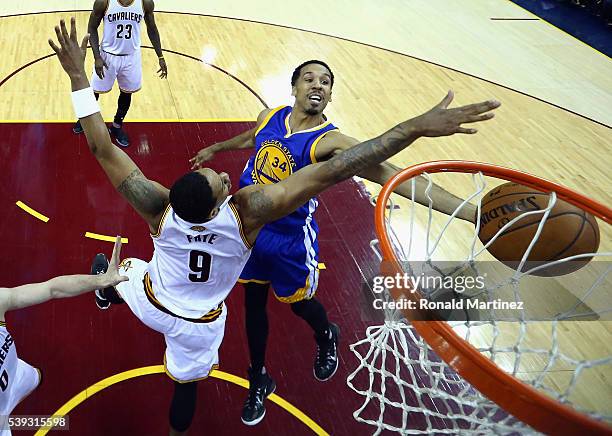 Shaun Livingston of the Golden State Warriors drives to the basket against Channing Frye of the Cleveland Cavaliers during the first half in Game 4...