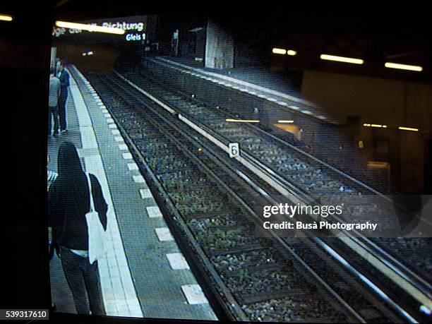 view of cctv camera monitor, surveillance inside subway station, berlin, germany - highway patrol stock-fotos und bilder