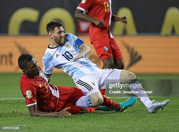 Lionel Messi of Argentina is pulled down by Roderick Miller of Panama after scoring his first goal of the match during the 2016 Copa America...