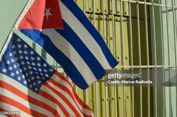 cuban and american flag at remedios, cuba - cuba fotografías e imágenes de stock