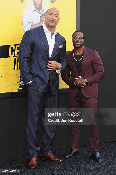 Actors Dwayne Johnson and Kevin Hart arrive at the Los Angeles Premiere "Central Intelligence" at Westwood Village Theatre on June 10, 2016 in...
