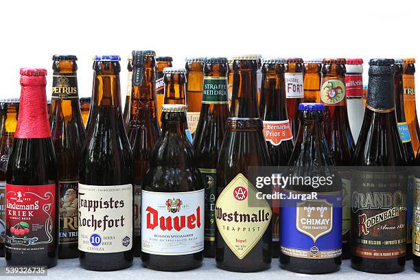 variety of traditional belgian beer in bottles - belgian culture stockfoto's en -beelden