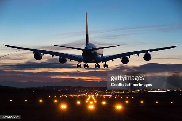 landing airplane - airport lights stock pictures, royalty-free photos & images