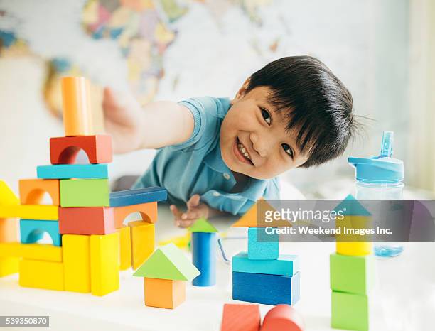 creating new cities - children playing with toys stockfoto's en -beelden
