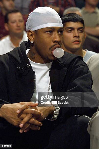 Guard Allen Iverson of the Philadelphia 76ers watches from the bench as he recovers from elbow surgery and his team faced the Houston Rockets at the...