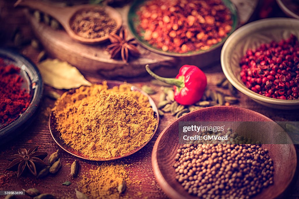 Spices and Herbs on Wooden Background