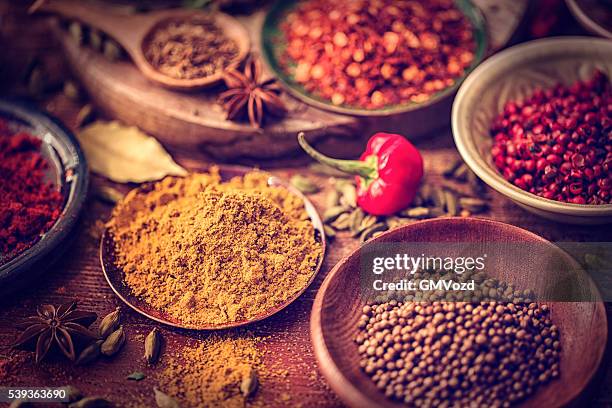 spices and herbs on wooden background - cayenne powder stock pictures, royalty-free photos & images