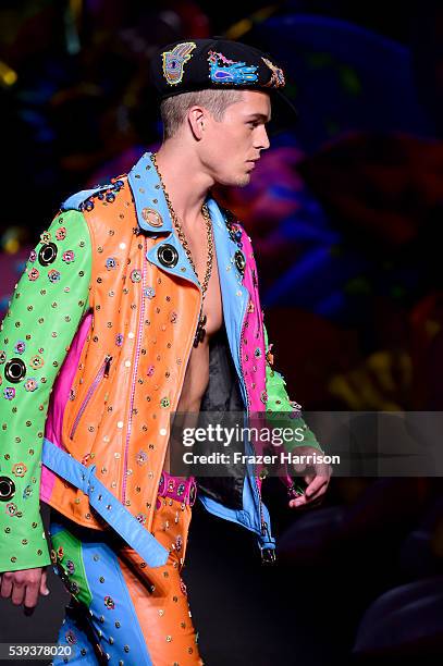 Model walks the runway at the Moschino Spring/Summer 17 Menswear and Women's Resort Collection during MADE LA at L.A. LIVE Event Deck on June 10,...
