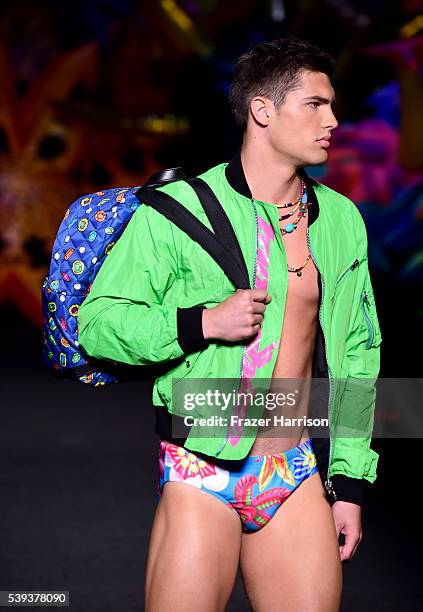 Model walks the runway at the Moschino Spring/Summer 17 Menswear and Women's Resort Collection during MADE LA at L.A. LIVE Event Deck on June 10,...