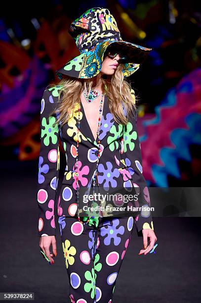 Model walks the runway at the Moschino Spring/Summer 17 Menswear and Women's Resort Collection during MADE LA at L.A. LIVE Event Deck on June 10,...