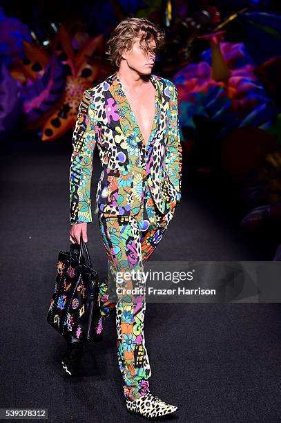 Model walks the runway at the Moschino Spring/Summer 17 Menswear and Women's Resort Collection during MADE LA at L.A. LIVE Event Deck on June 10,...