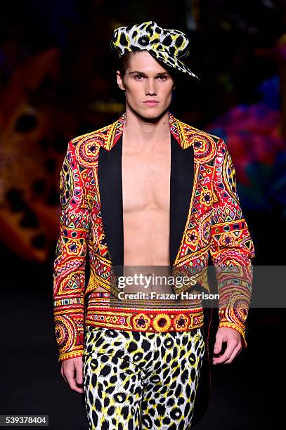 Model walks the runway at the Moschino Spring/Summer 17 Menswear and Women's Resort Collection during MADE LA at L.A. LIVE Event Deck on June 10,...