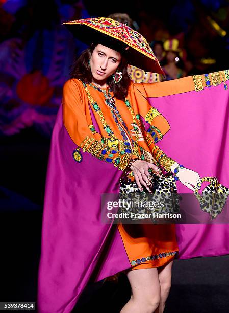 Model walks the runway at the Moschino Spring/Summer 17 Menswear and Women's Resort Collection during MADE LA at L.A. LIVE Event Deck on June 10,...