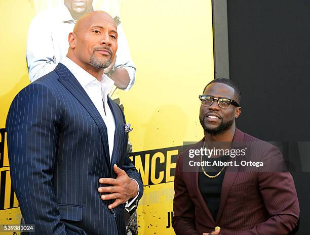 Actors Dwayne Johnson and Kevin Hart arrive for the Premiere Of Warner Bros. Pictures' "Central Intelligence" held at Westwood Village Theatre on...
