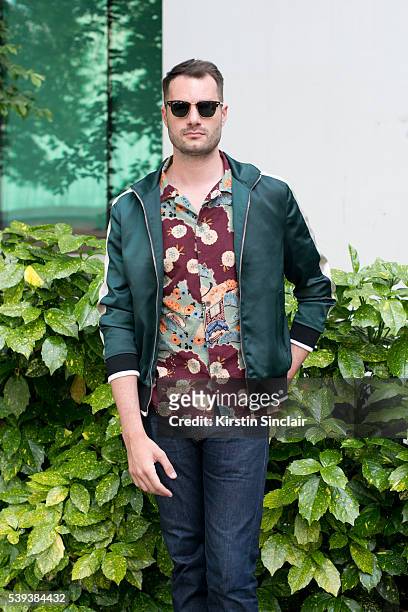 Presenter Stevie Kelly wears Hawksmill jeans, YMC shirt, New Look jacket and Ray Ban sunglasses on day 1 of London Collections: Men on June 10, 2016...