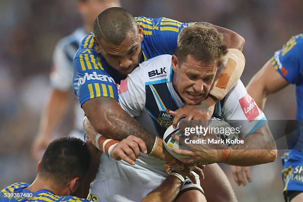 William Zillman of the Titans is tackled during the round 14 NRL match between the Parramatta Eels and the Gold Coast Titans at TIO Stadium on June...