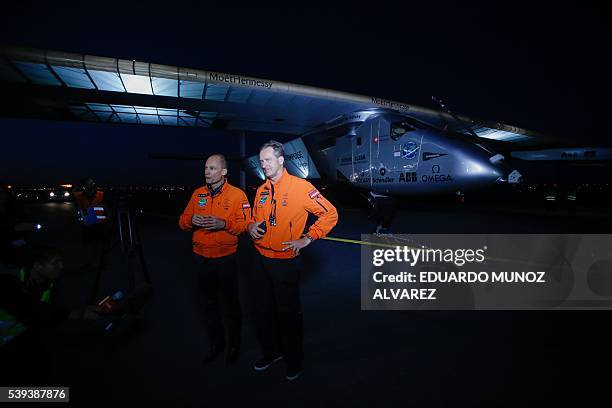Swiss pilot Andre Borschberg and Swiss pilot Bertrand Piccard speak with the media after successfully landing the Solar Impulse 2 aircraft at JFK...
