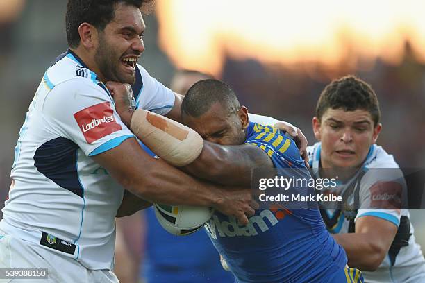 Conrad Hurrell of the Titans tackles Manu Ma'u of the Eels during the round 14 NRL match between the Parramatta Eels and the Gold Coast Titans at TIO...